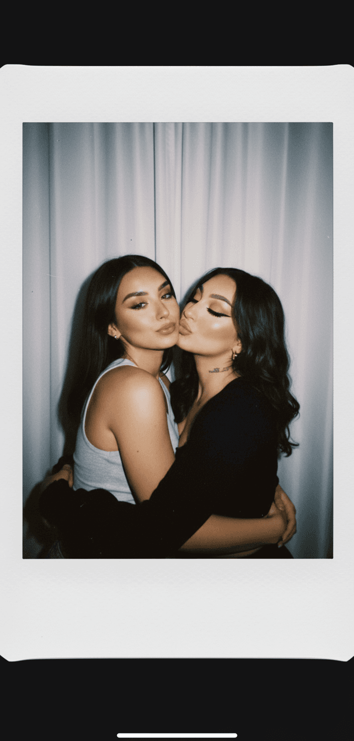 Make a picture taken with a Polaroid camera. The photo should have a slight blur effect and a consistent light source, such as a flash from a dark room, scattered throughout the photo. Do not change the face. Replace the background behind the two people with a white curtain. Both girls are kissing and hugging each other